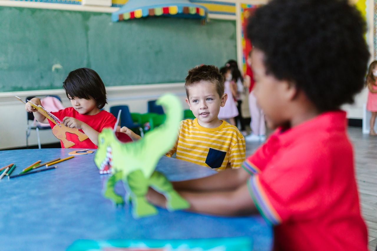 Kids engaging in play and learning activities in a vibrant classroom.